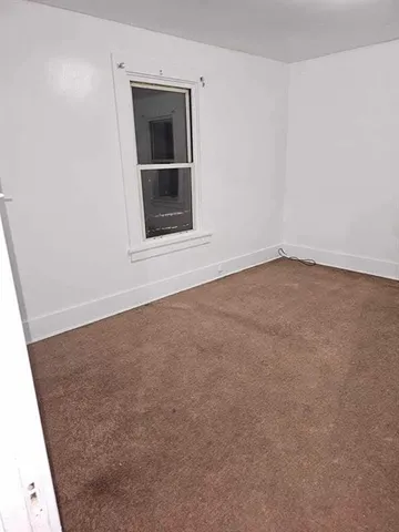 a view of empty room with front door