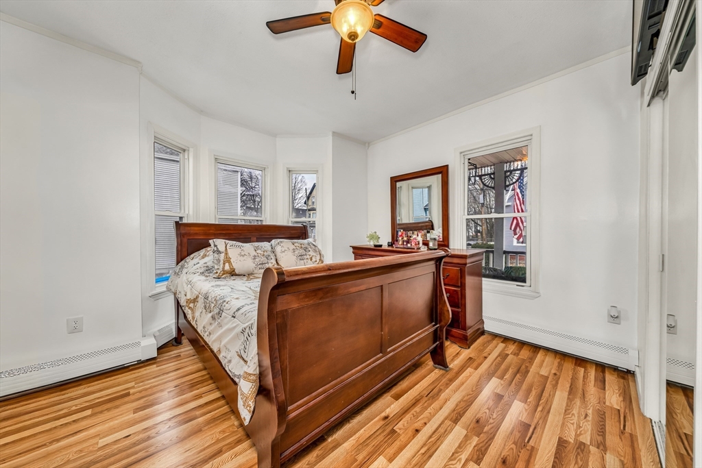 8 Ford Street Haverhill, MA 01832 - Photo 18 of 41 a bed room with a bed and a chandelier fan