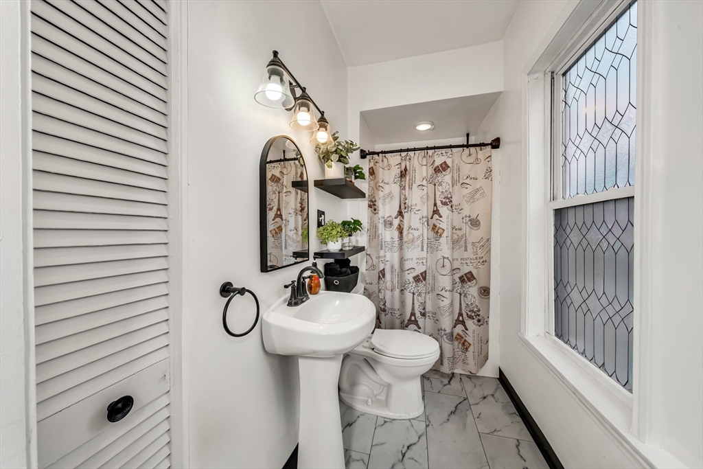 8 Ford Street Haverhill, MA 01832 - Photo 19 of 41 a bathroom with a sink toilet and shower