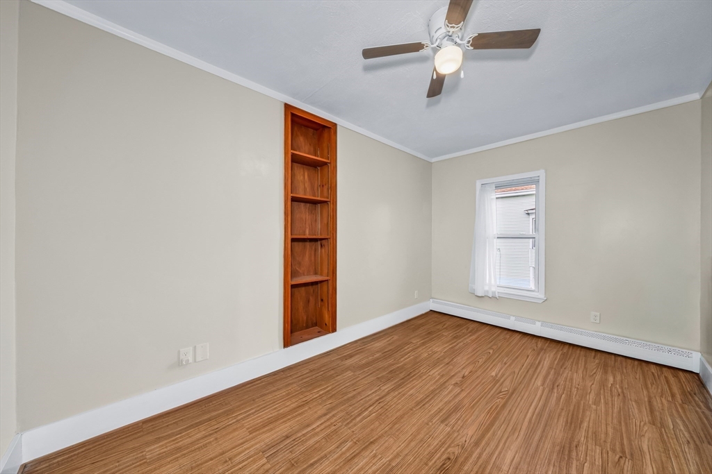 8 Ford Street Haverhill, MA 01832 - Photo 20 of 41 wooden floor in an empty room with a window