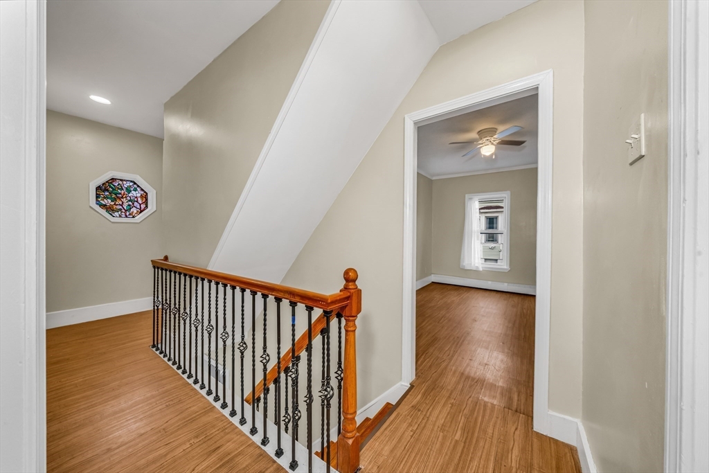 8 Ford Street Haverhill, MA 01832 - Photo 23 of 41 a view of a hallway with wooden floor and a bathroom