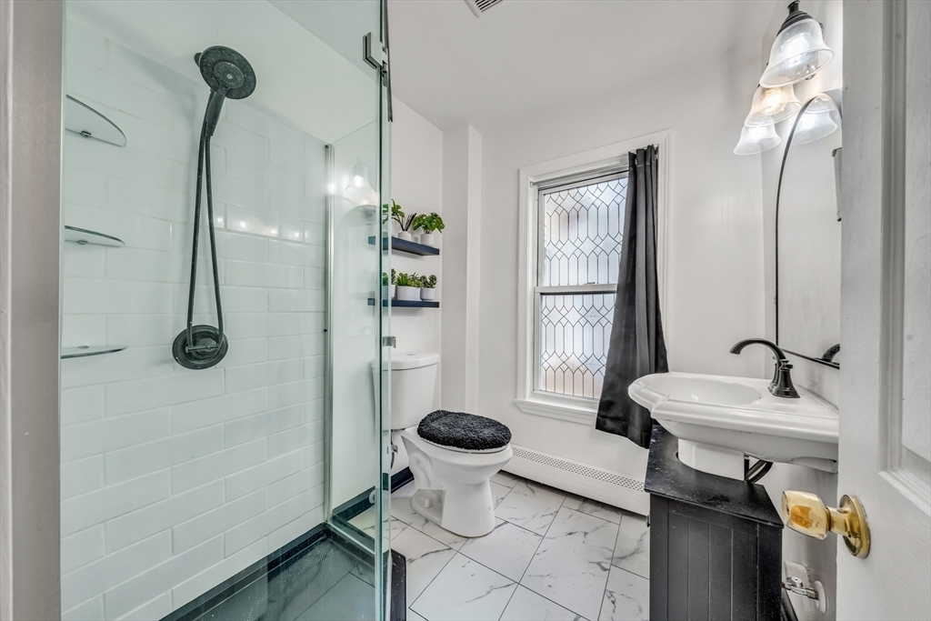 8 Ford Street Haverhill, MA 01832 - Photo 24 of 41 a bathroom with a sink toilet and shower