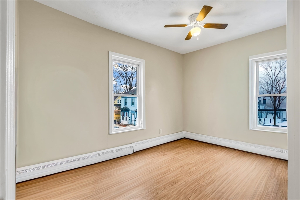 8 Ford Street Haverhill, MA 01832 - Photo 25 of 41 an empty room with wooden floor and windows