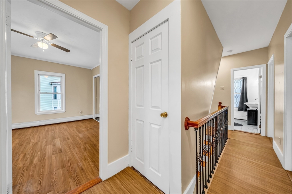 8 Ford Street Haverhill, MA 01832 - Photo 27 of 41 a view of a hallway with wooden floor and staircase