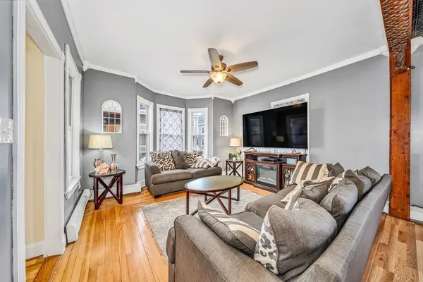 a living room with furniture and a flat screen tv