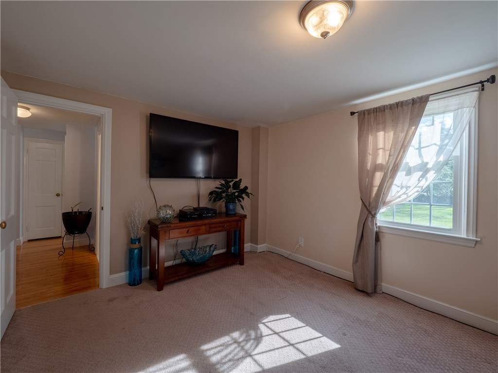 303 Crestwood Road Warwick, RI 02886 - Photo 16 of 43 Den/First Floor Bedroom 2--Hardwoods under rug.