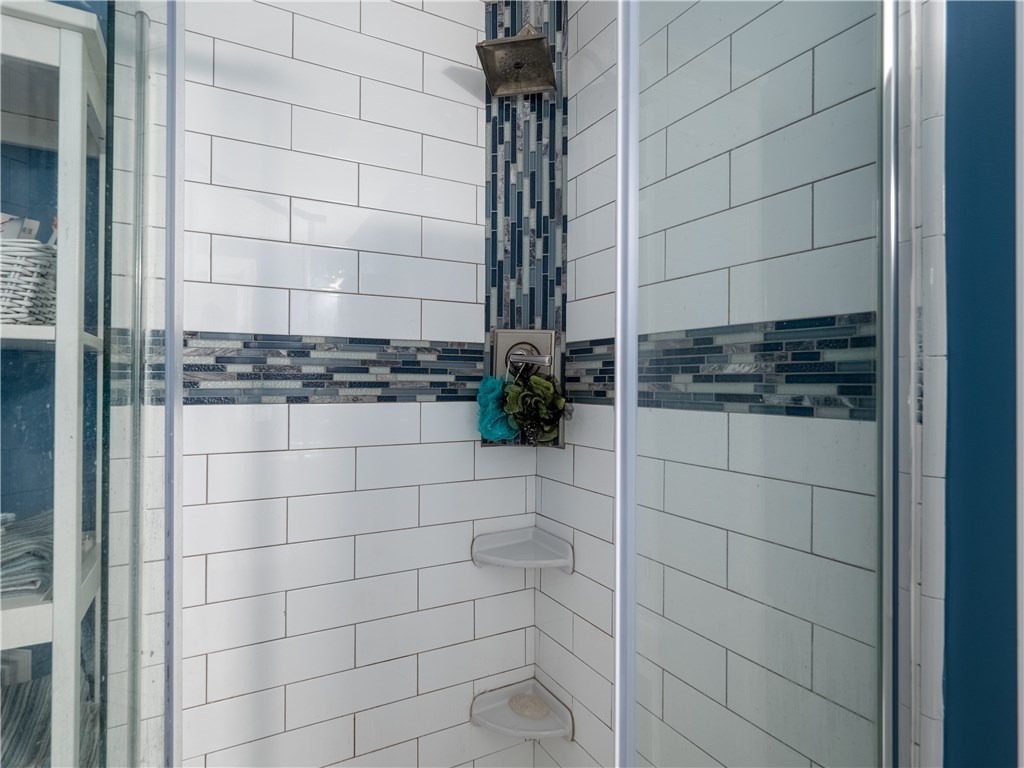 303 Crestwood Road Warwick, RI 02886 - Photo 18 of 43 First Floor Bathroom with oversized Custom Tile shower.