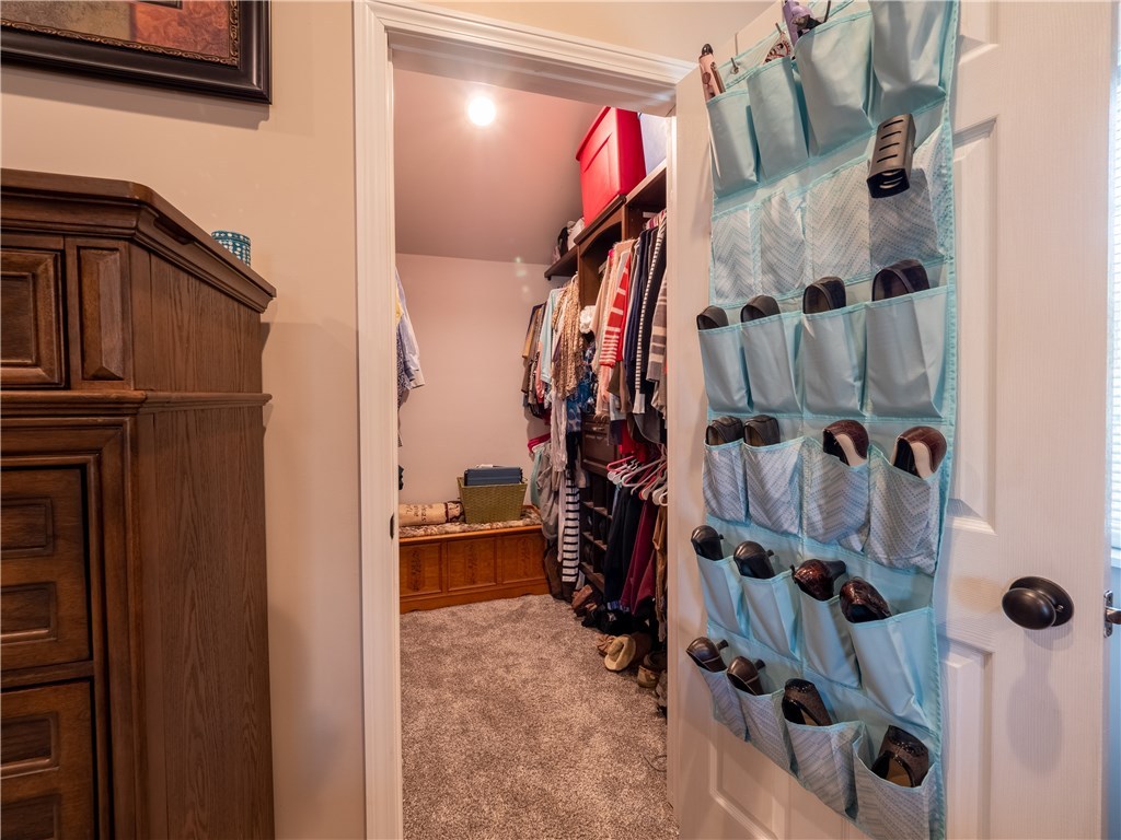 303 Crestwood Road Warwick, RI 02886 - Photo 23 of 43 The Master walk-in closet has 2 sets of custom built-ins.