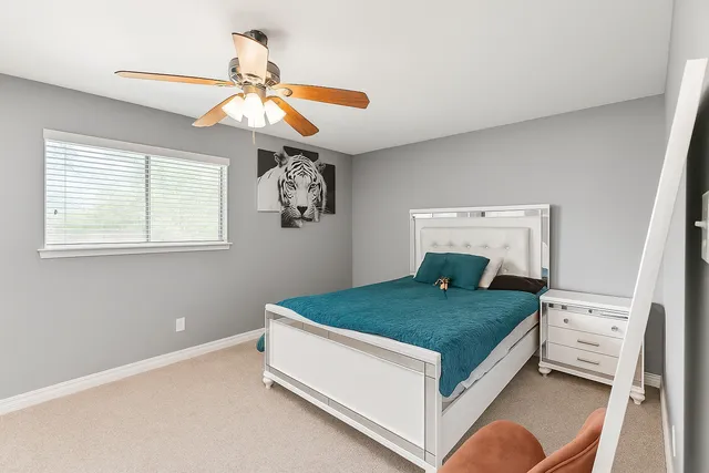 a room with a bed and a window