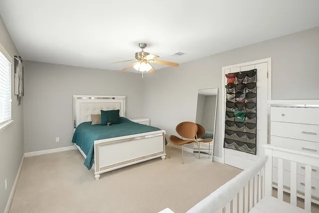 a bedroom with a bed and dresser