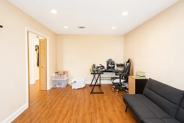 a workspace with furniture and wooden floor