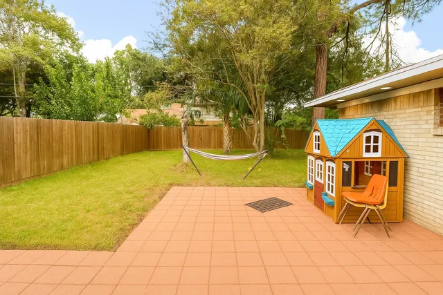 a view of a swimming pool with a lounge chair