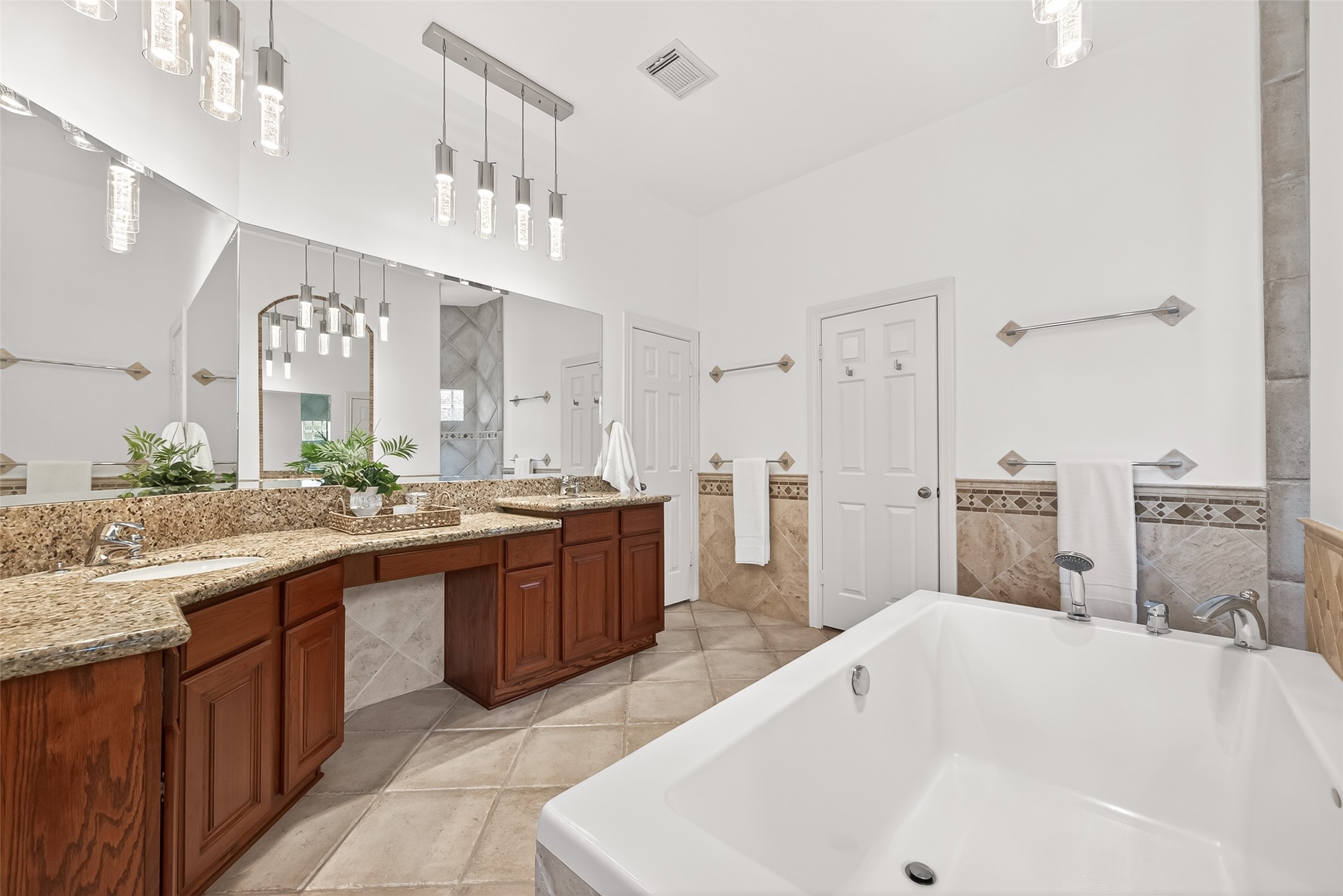 4203 Deforest Ridge Circle Katy, TX 77494 - Photo 23 of 50 Luxurious primary bath designed for relaxation and comfort with plenty of room for two to get ready for the day with double sinks and vanity area