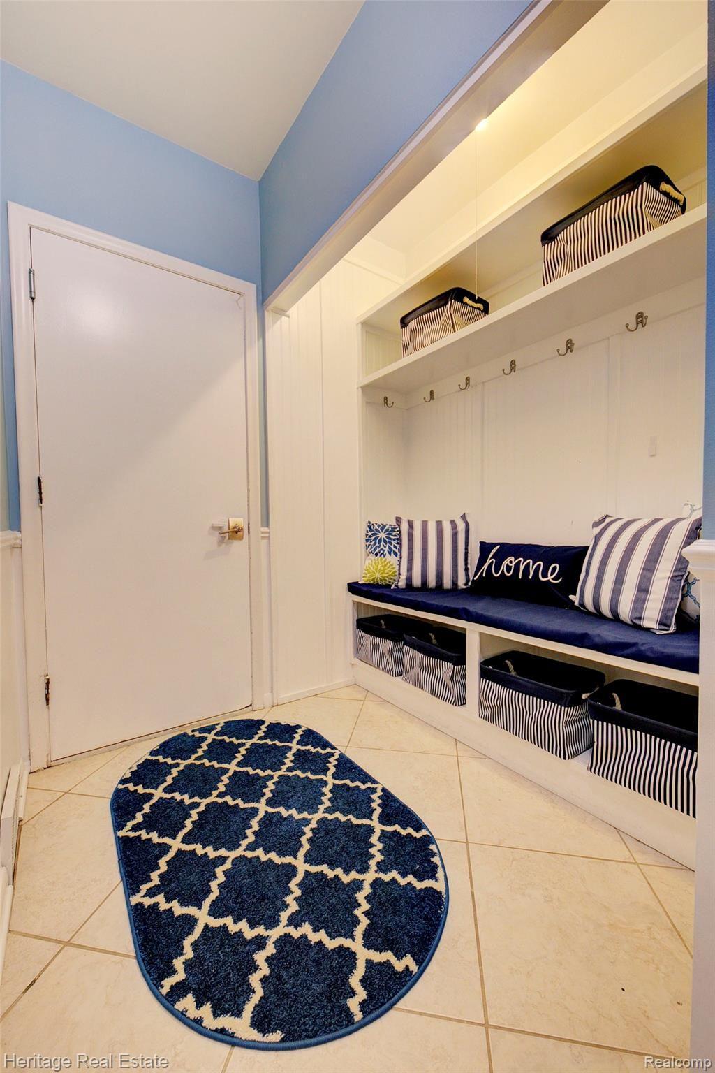 654 Old Perch Road Rochester, MI 48309 - Photo 30 of 61 Mud room area in the hallway leading to the garage features built in seating and storage