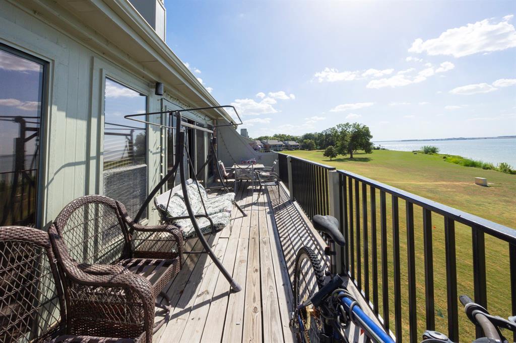 1418 Signal Ridge Place Rockwall, TX 75032 - Photo 35 of 35 Expansive wood-finish deck with black metal railings