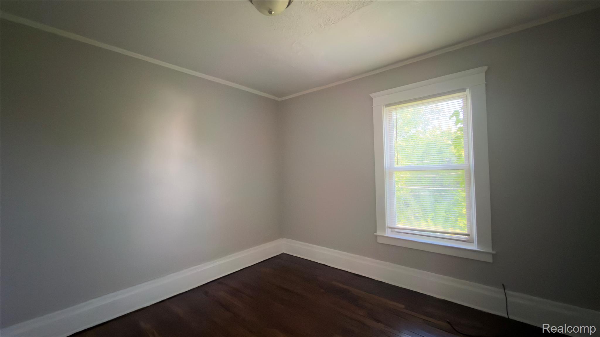 9426 John R Street Detroit, MI 48202 - Photo 15 of 17 Interior room featuring dark wood-finish flooring and light gray walls