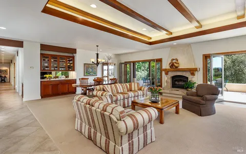 a kitchen with a table and chairs