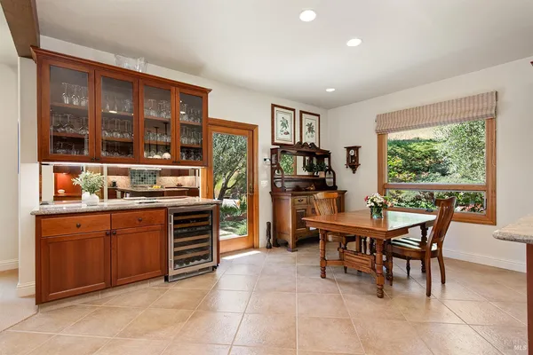 a kitchen with stainless steel appliances granite countertop a stove and a refrigerator