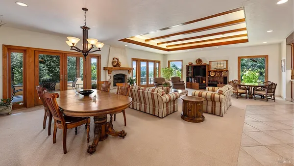 a living room with furniture a window and a table