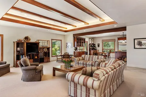 a view of a dining room with furniture and window