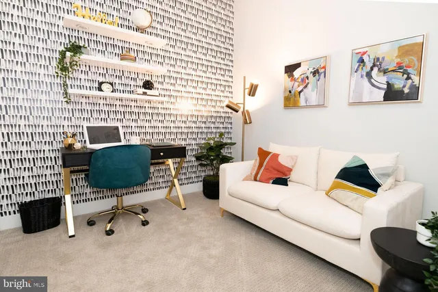 a living room with furniture and a lamp