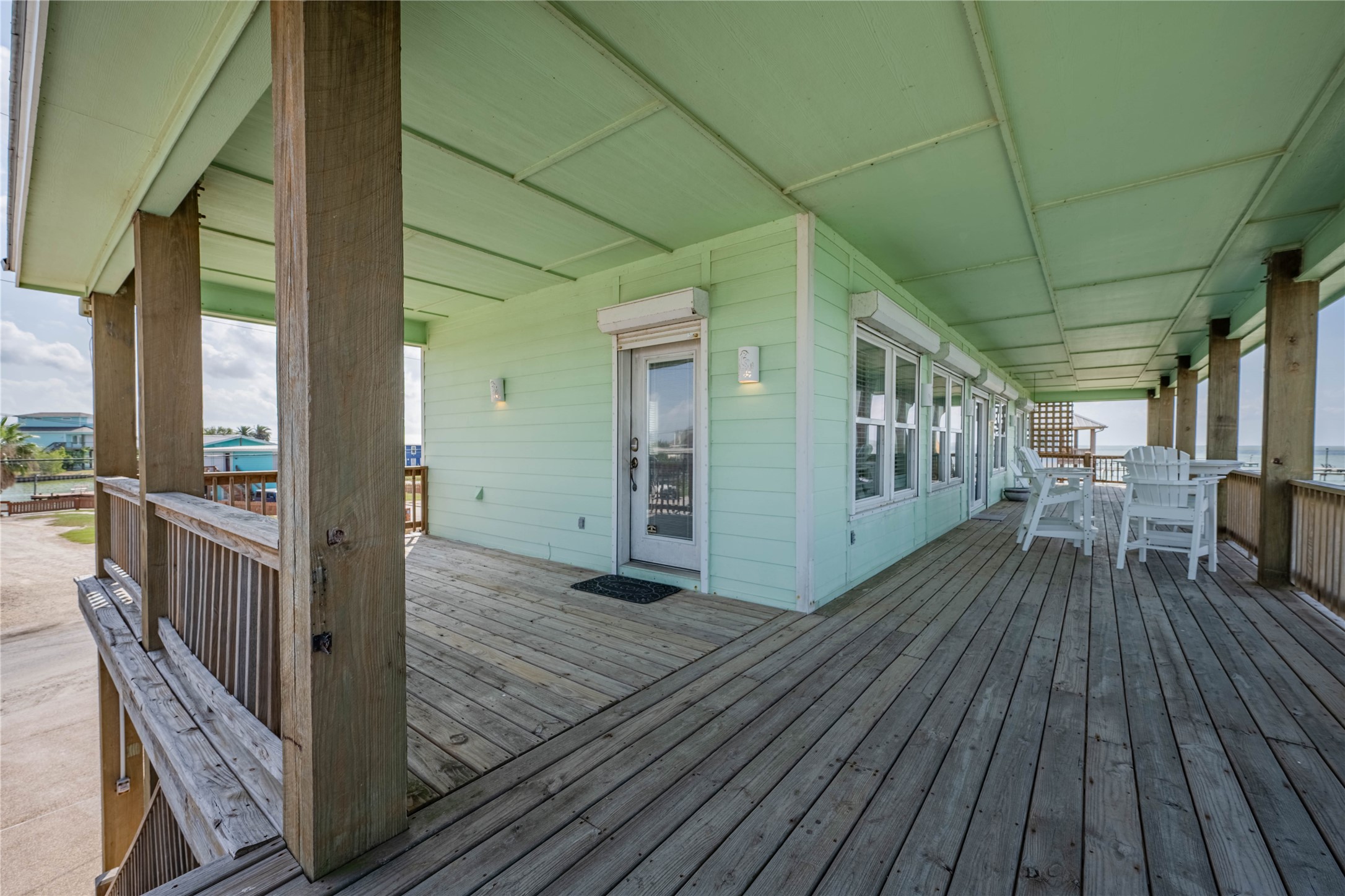 740 Copano Cove Road Rockport, TX 78382 - Photo 13 of 35 a view of a balcony with wooden floor