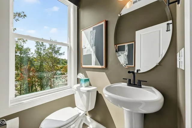 a bathroom with a sink a mirror and a shower