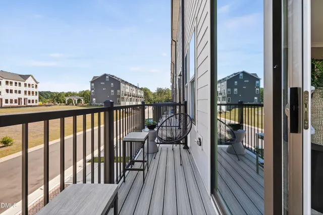 a kitchen with stainless steel appliances kitchen island granite countertop a stove a sink and a refrigerator