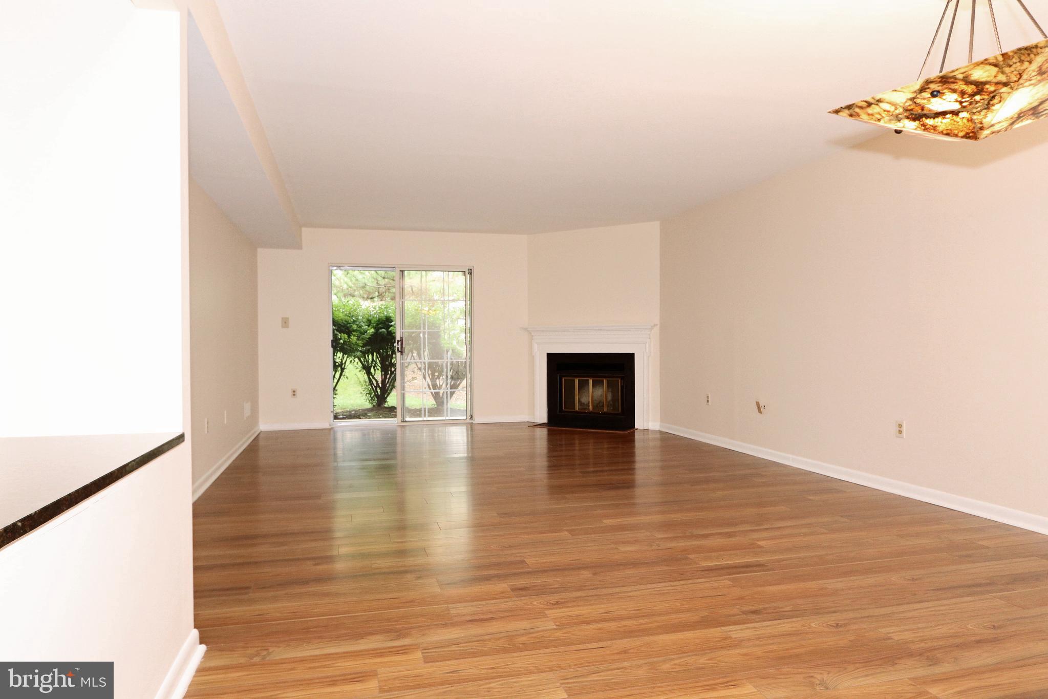 161 Valley Stream Lane Chesterbrook, PA 19087 - Photo 10 of 28 Dining/Living Room with Fireplace