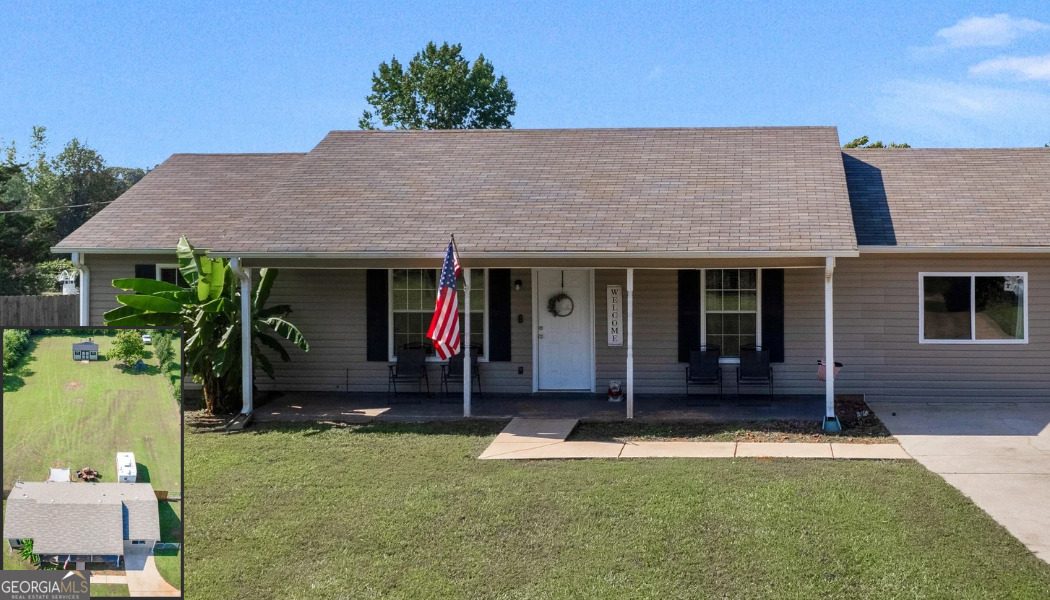 2064 Swint Road Griffin, GA 30224 - Photo 1 of 1 a front view of a house with a garden