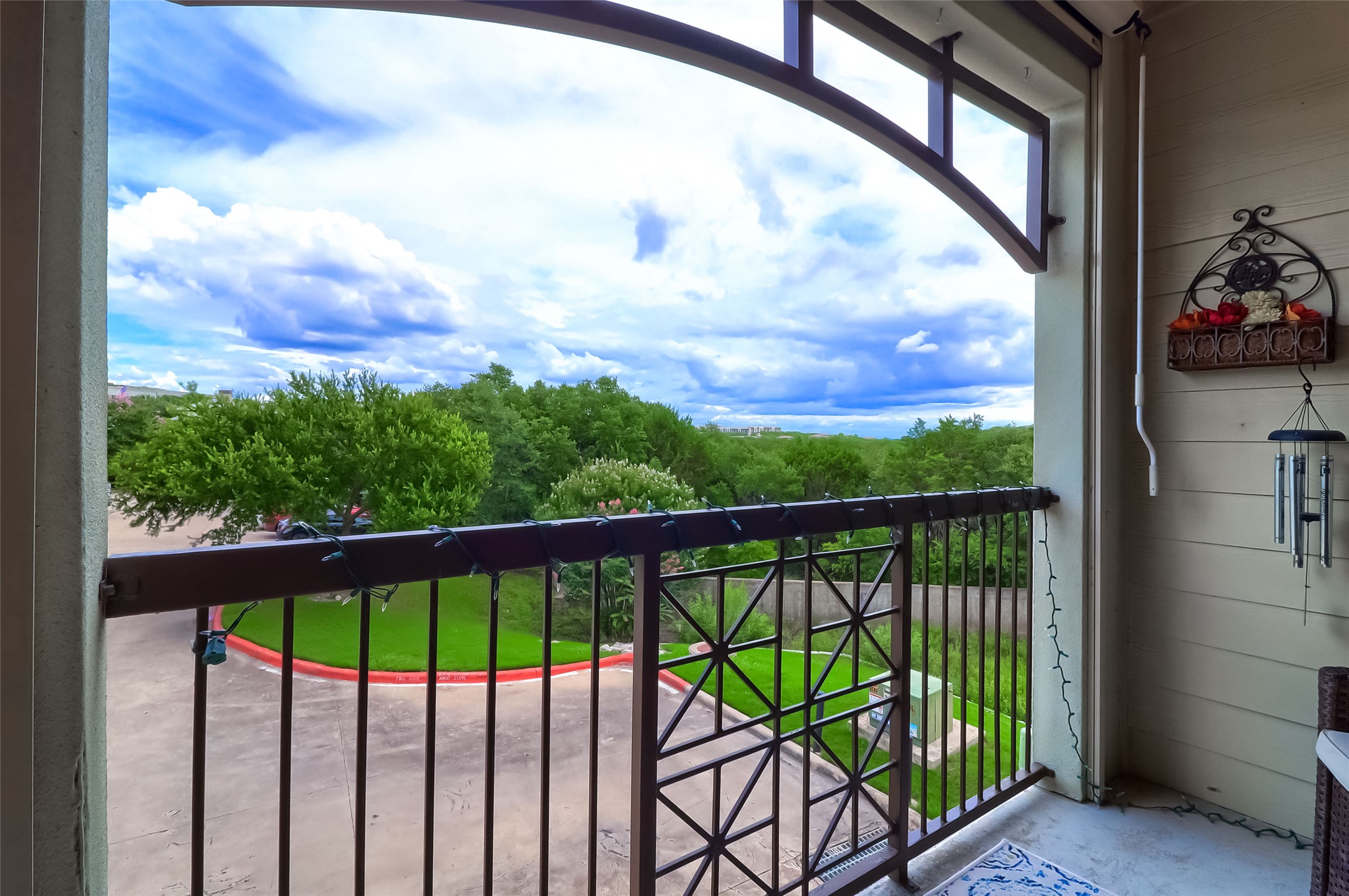 7701 Rialto Boulevard, Unit 1128 Austin, TX 78735 - Photo 27 of 35 a view of a balcony with a small yard