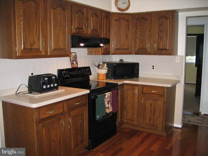 15006 Rolling Ridge Road Haymarket, VA 20169 - Photo 6 of 22 Kitchen features solid surface counters