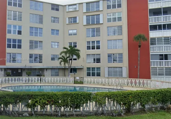 a view of a building with a garden