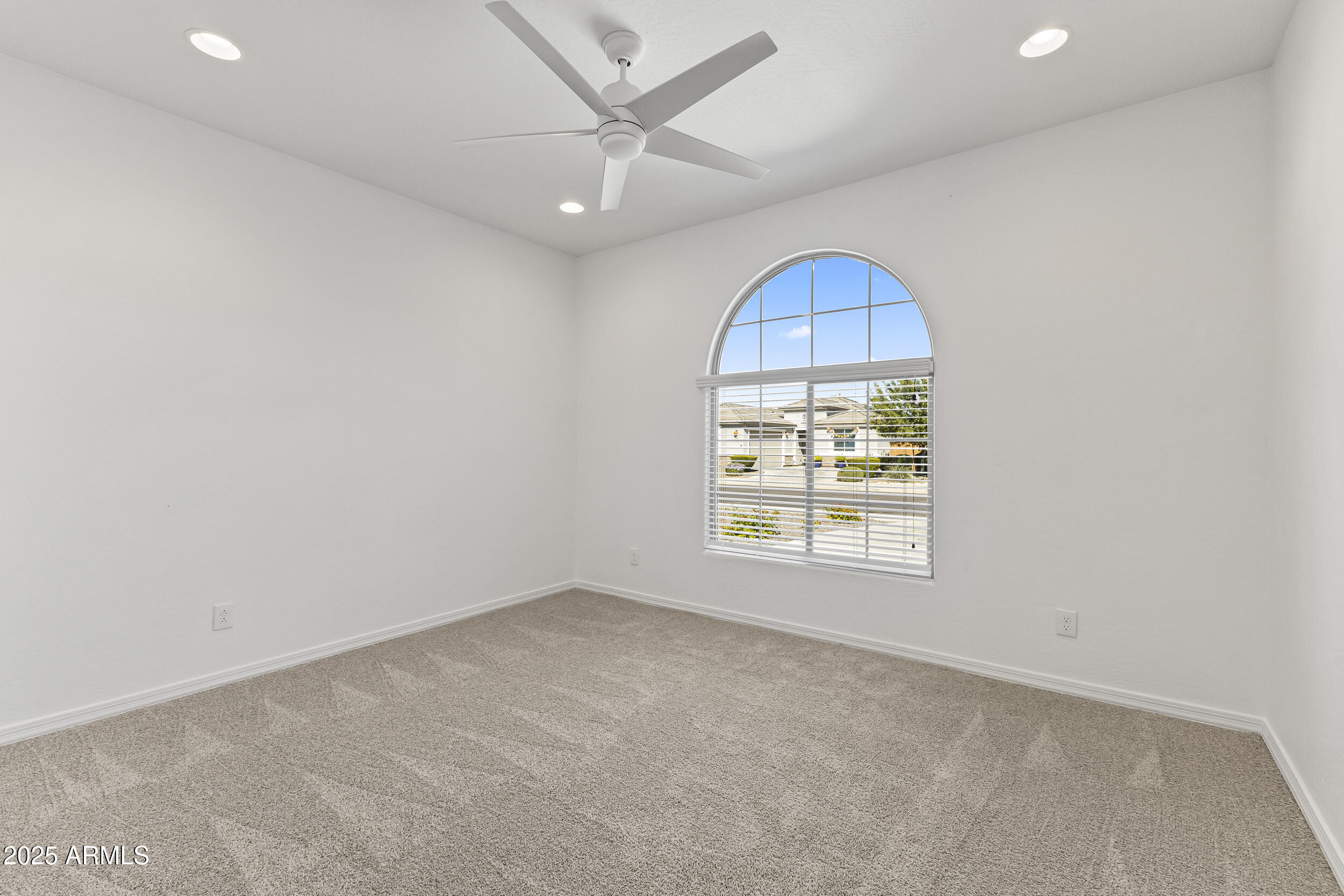 25915 West Quail Avenue Buckeye, AZ 85396 - Photo 11 of 73 an empty room with a cabinet and a window