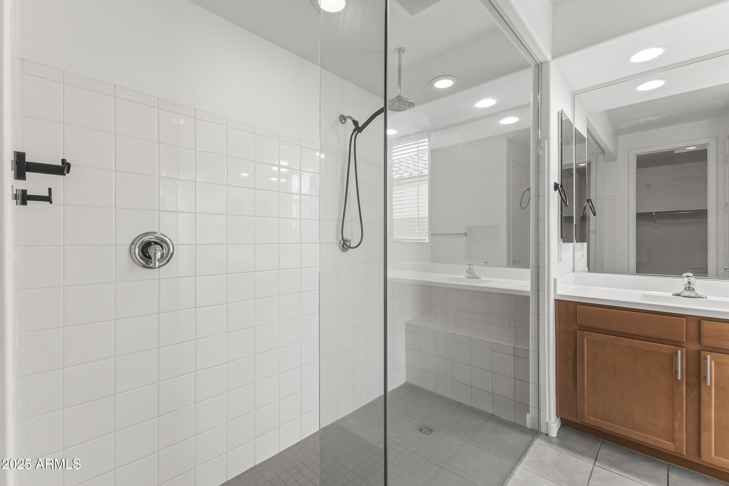 25915 West Quail Avenue Buckeye, AZ 85396 - Photo 34 of 73 a bathroom with a shower and a sink