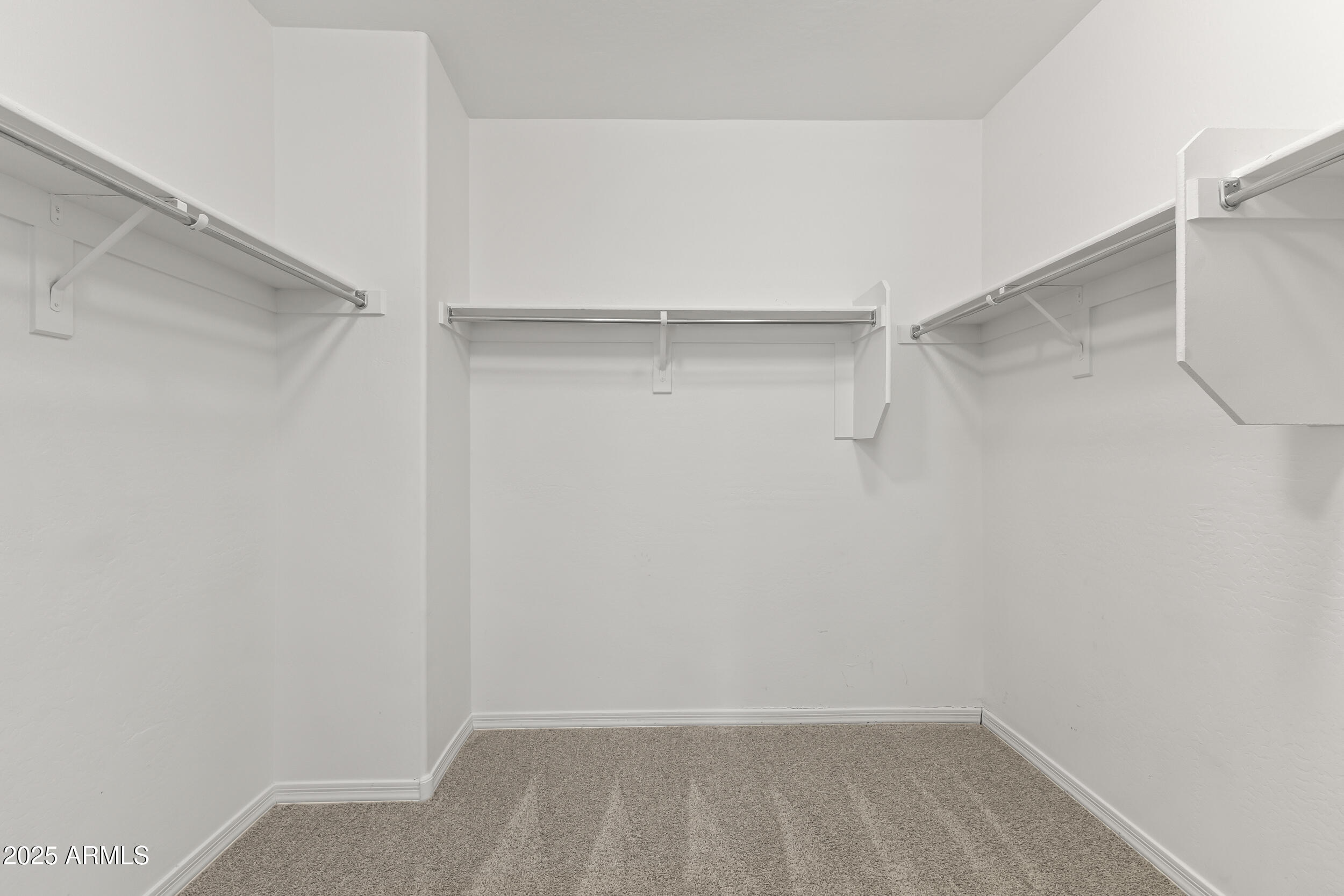 25915 West Quail Avenue Buckeye, AZ 85396 - Photo 36 of 73 a view of an empty walk in closet
