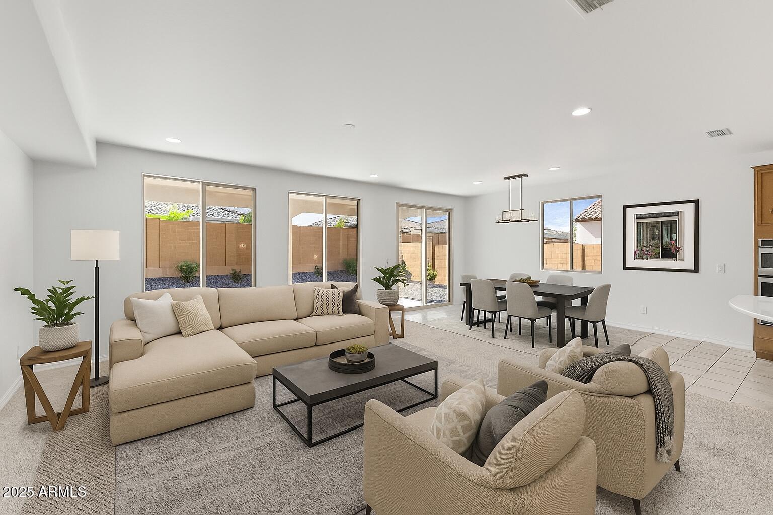 25915 West Quail Avenue Buckeye, AZ 85396 - Photo 4 of 73 a living room with furniture and a large window
