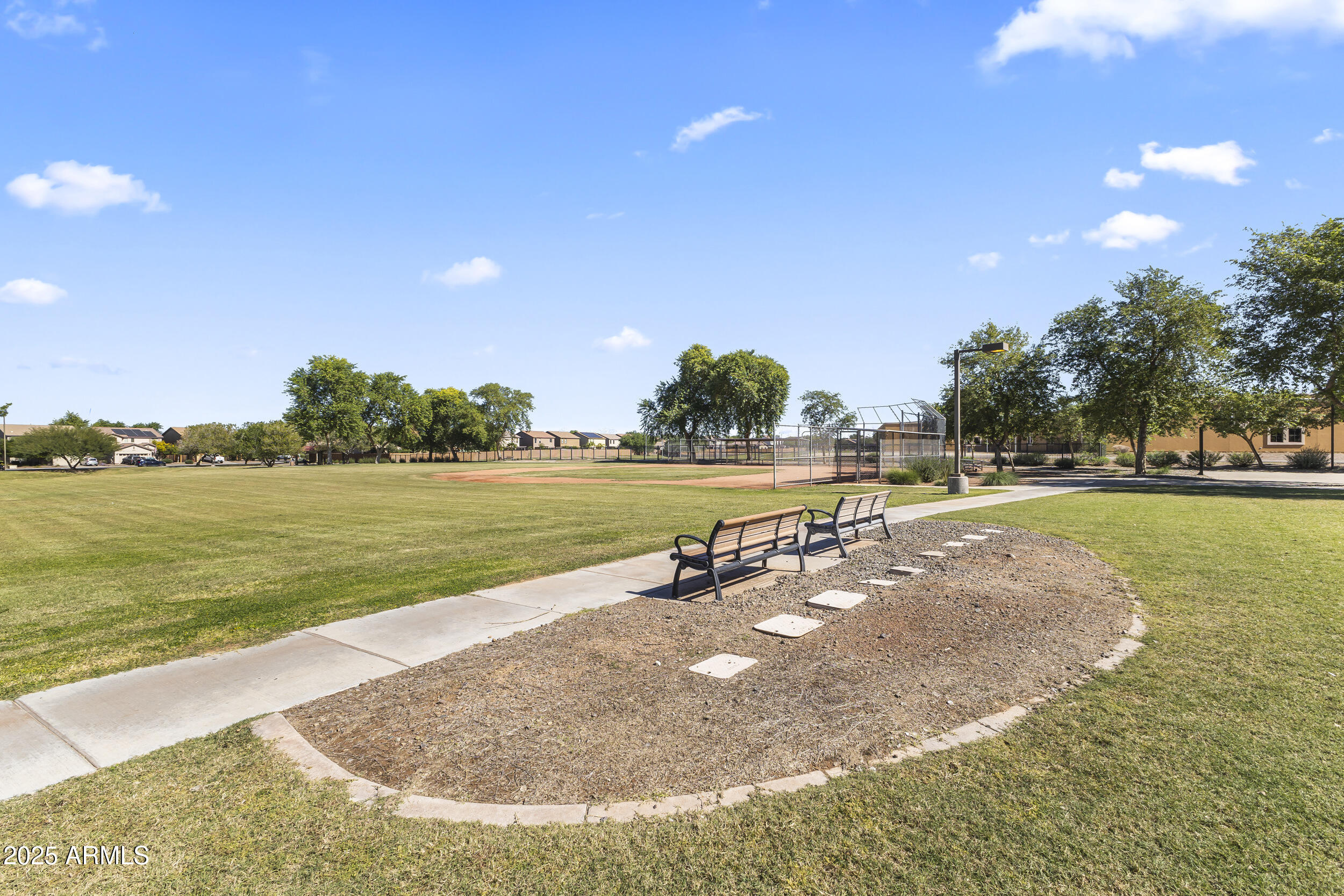 25915 West Quail Avenue Buckeye, AZ 85396 - Photo 64 of 73 a view of a lake with a yard