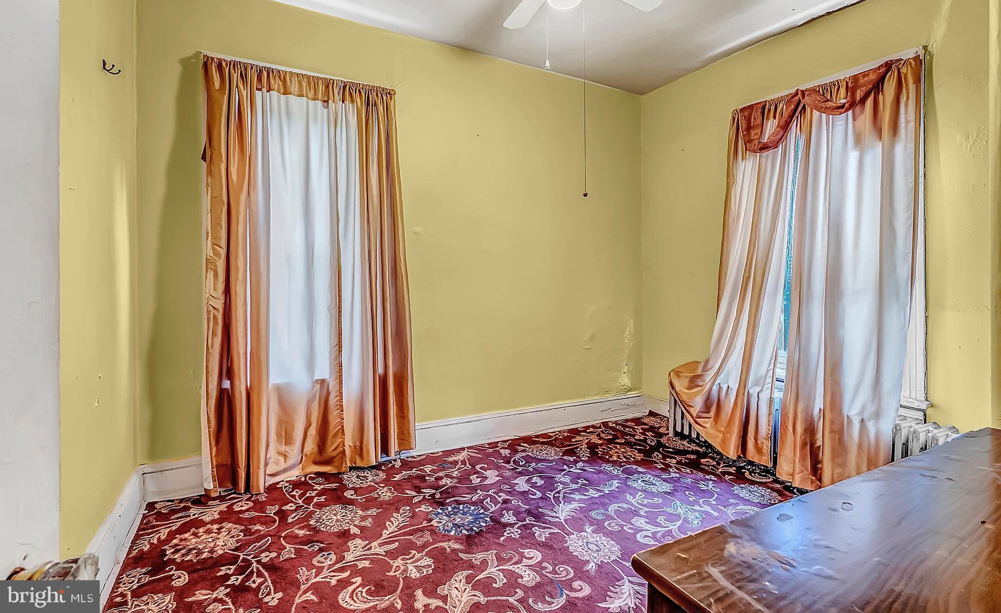 422 Rutherford Avenue Trenton, NJ 08618 - Photo 12 of 19 a bedroom with a bed and a window