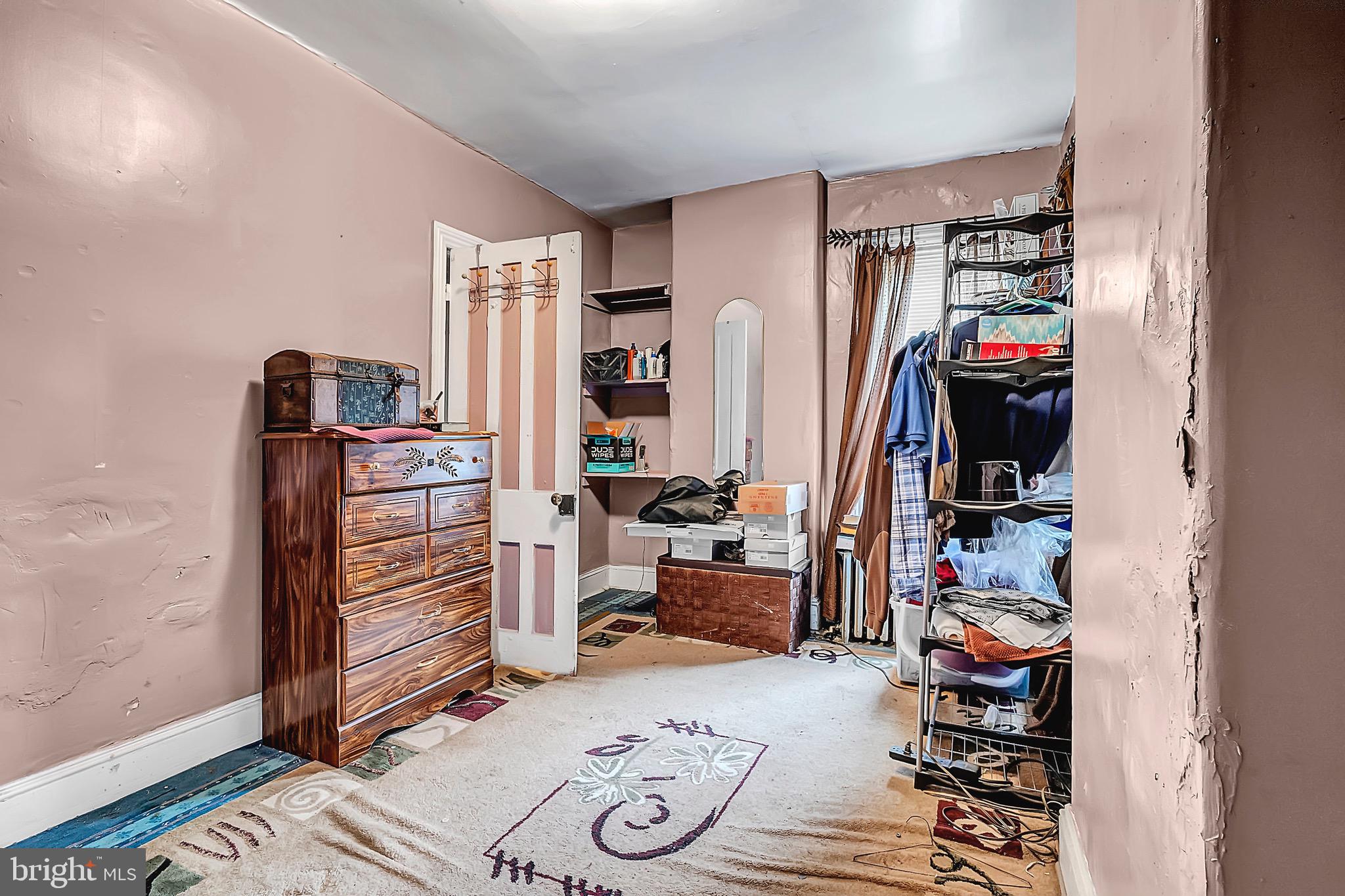 422 Rutherford Avenue Trenton, NJ 08618 - Photo 15 of 19 a view of a livingroom with furniture and closet