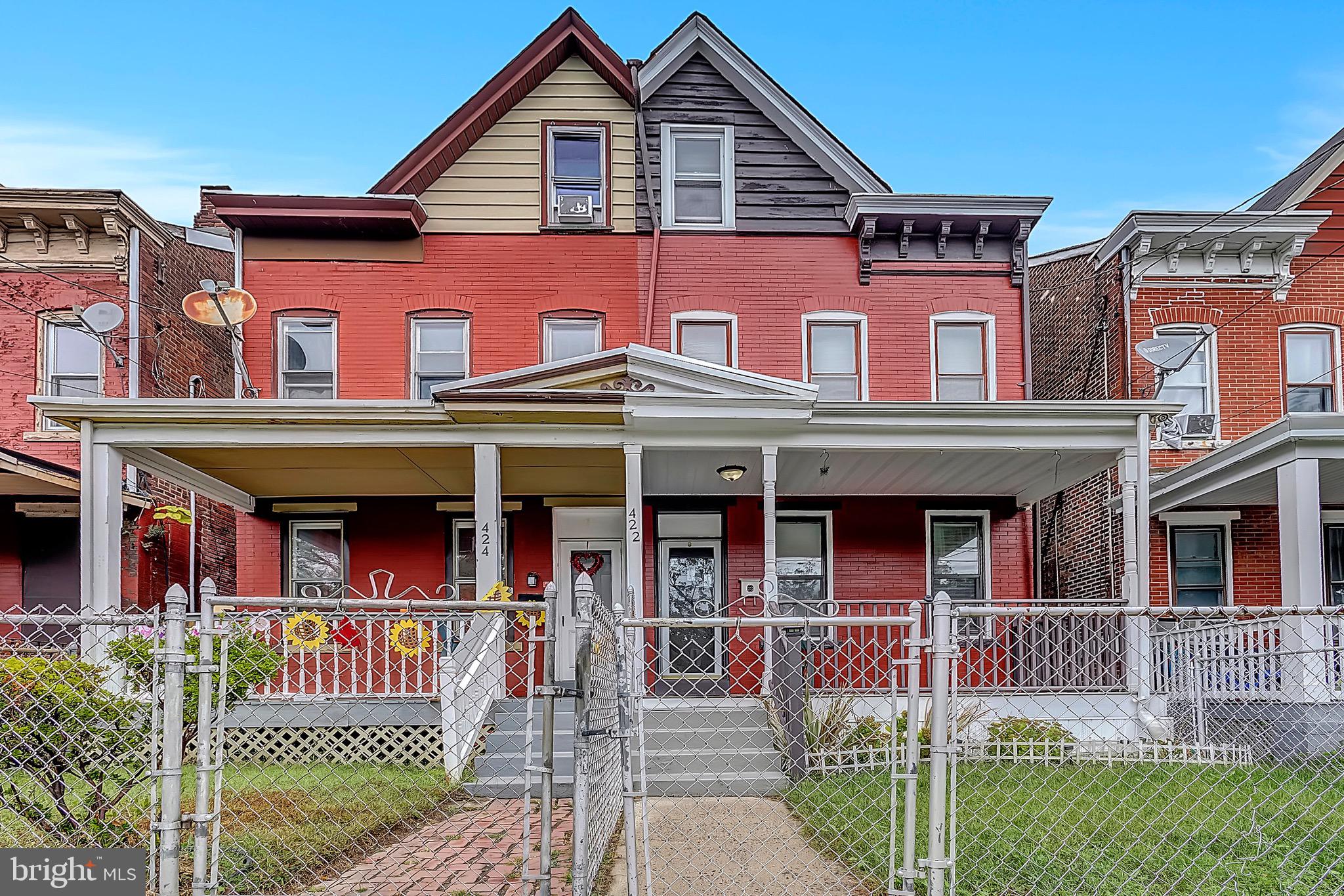 422 Rutherford Avenue Trenton, NJ 08618 - Photo 2 of 19 a front view of a brick building with a large windows