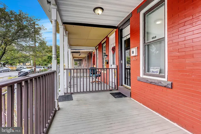 an entrance view of a house with wooden floor
