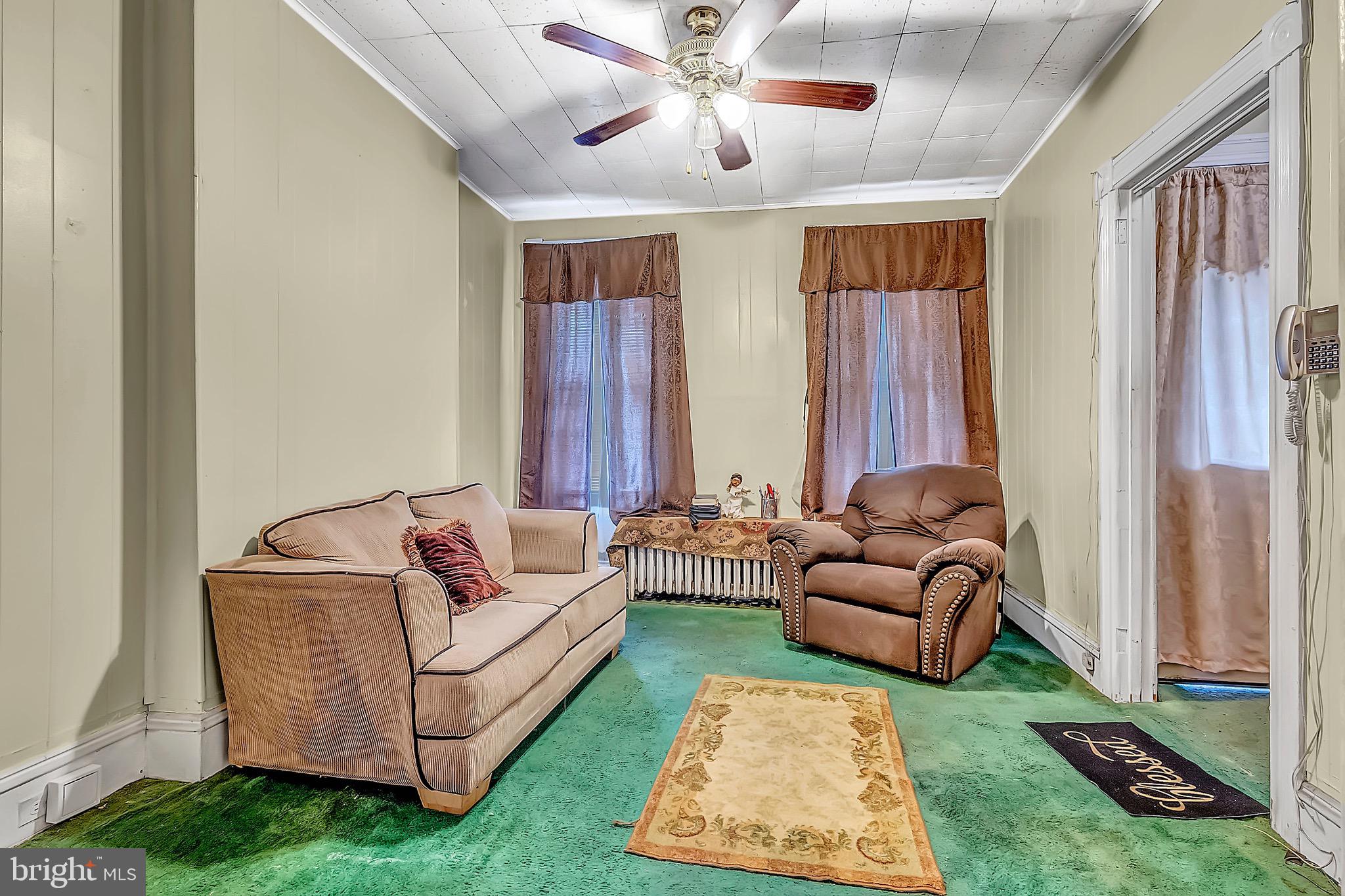 422 Rutherford Avenue Trenton, NJ 08618 - Photo 5 of 19 a living room with furniture and a large window