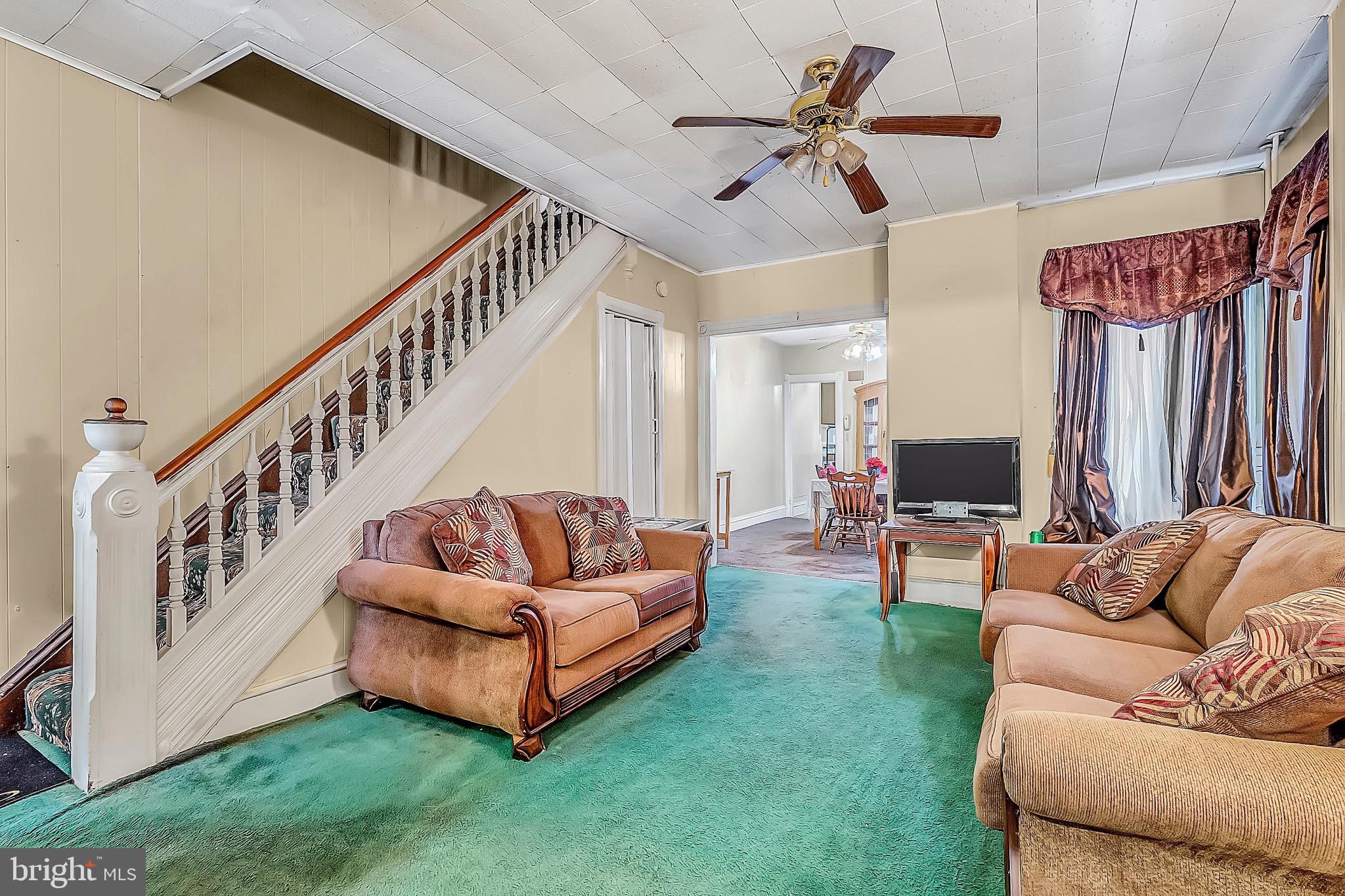 422 Rutherford Avenue Trenton, NJ 08618 - Photo 6 of 19 a living room with furniture and a flat screen tv