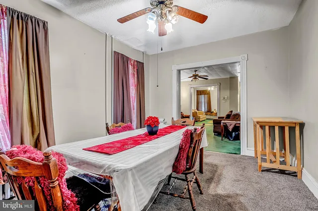 a room that has a bed and a chandelier