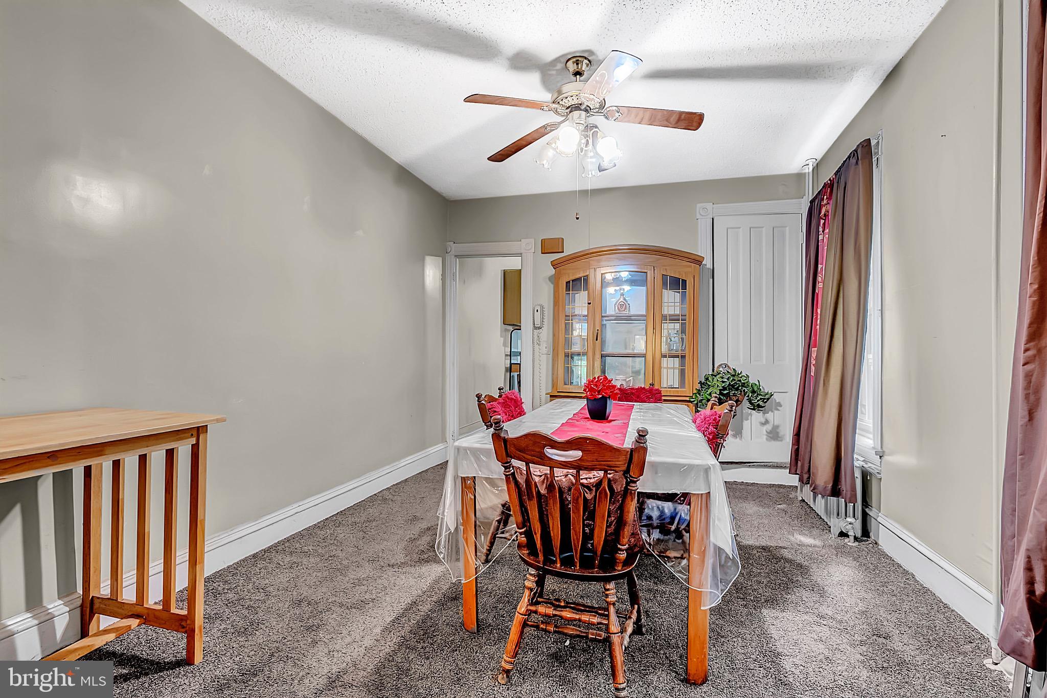 422 Rutherford Avenue Trenton, NJ 08618 - Photo 9 of 19 a view of a dining room with furniture and a chandelier