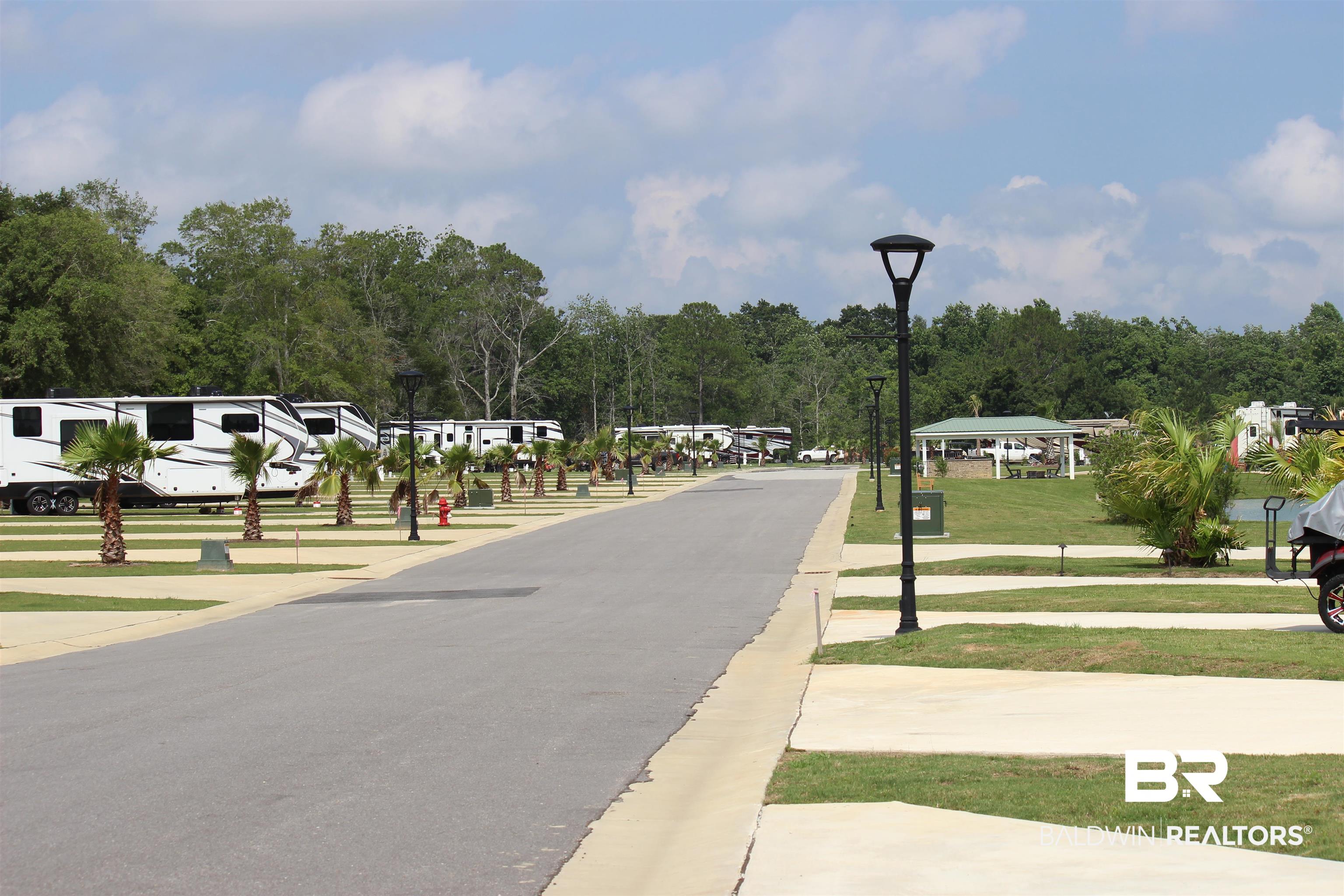 12451 Gateway Drive Elberta, AL 36530 - Photo 46 of 47 View of asphalt road featuring street lights