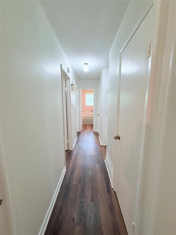 160 Bob White Road Denison, TX 75020 - Photo 13 of 29 Corridor featuring wood-finish flooring, light-toned walls, and flush-mount lighting