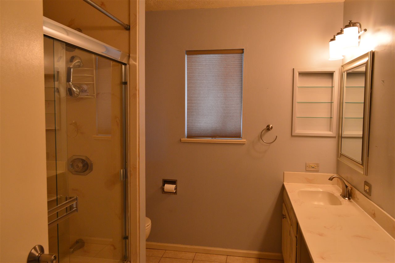 737 25 Road Grand Junction, CO 81505 - Photo 9 of 21 a bathroom with a tub sink and mirror