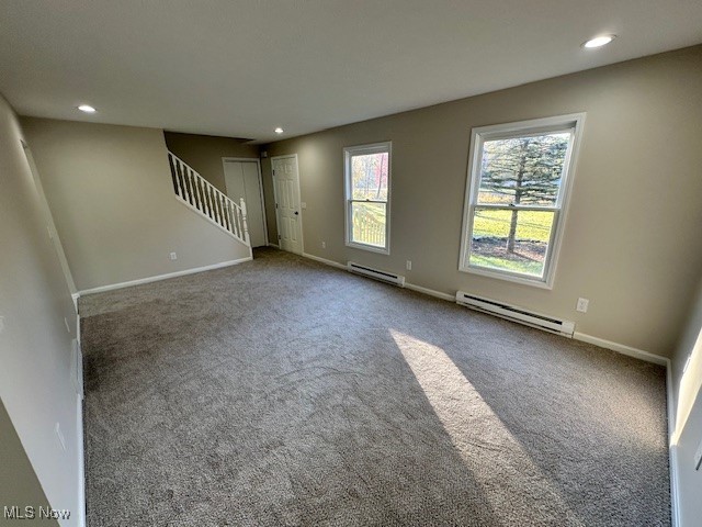 5841 Neff Road Valley City, OH 44280 - Photo 9 of 24 Unfurnished living room featuring carpet floors and baseboard heating